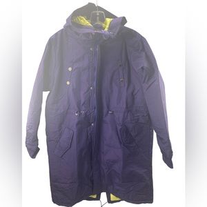 NWT Long purple jacket with neon color inside. 4 pockets on the outside.
